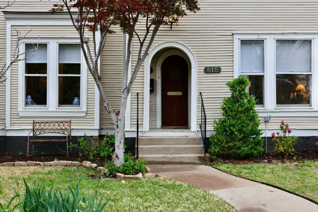 front of a house with tree out front