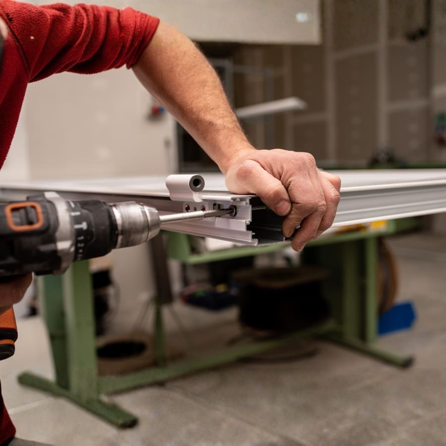 Worker Assembling Window Frame