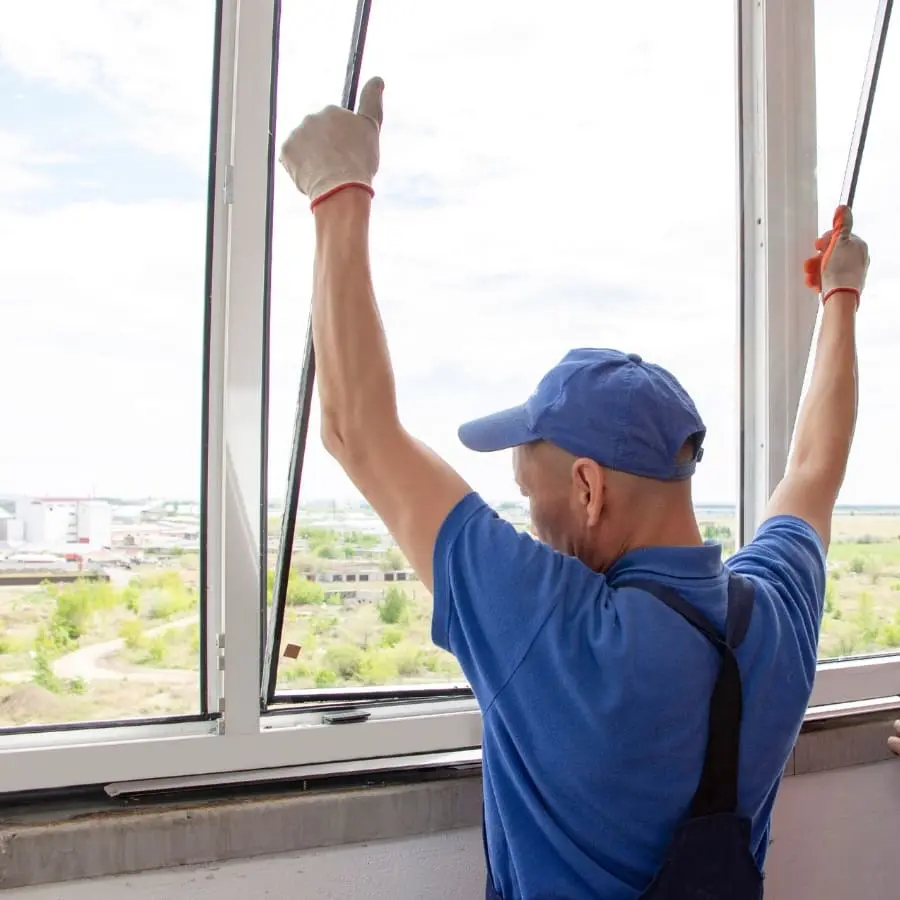 Technician Fitting Window Pane