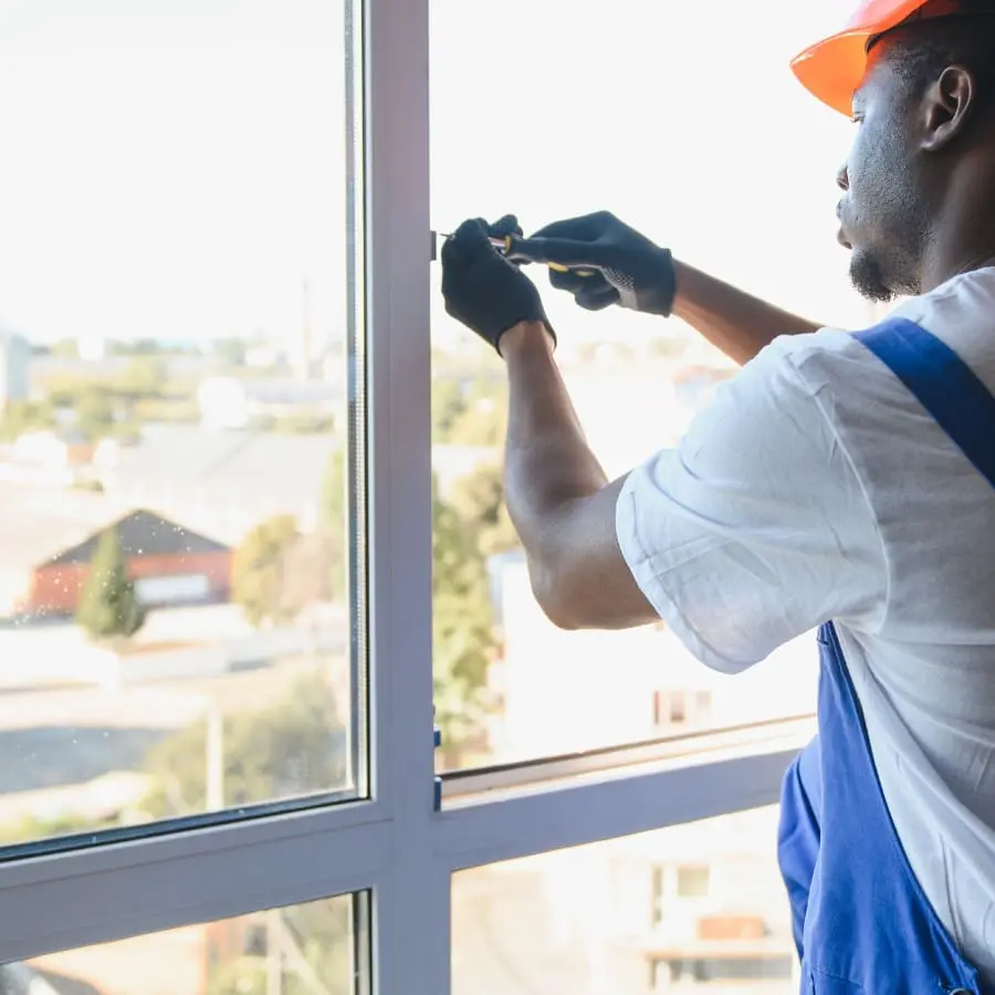 Technician Fixing a Window Frame